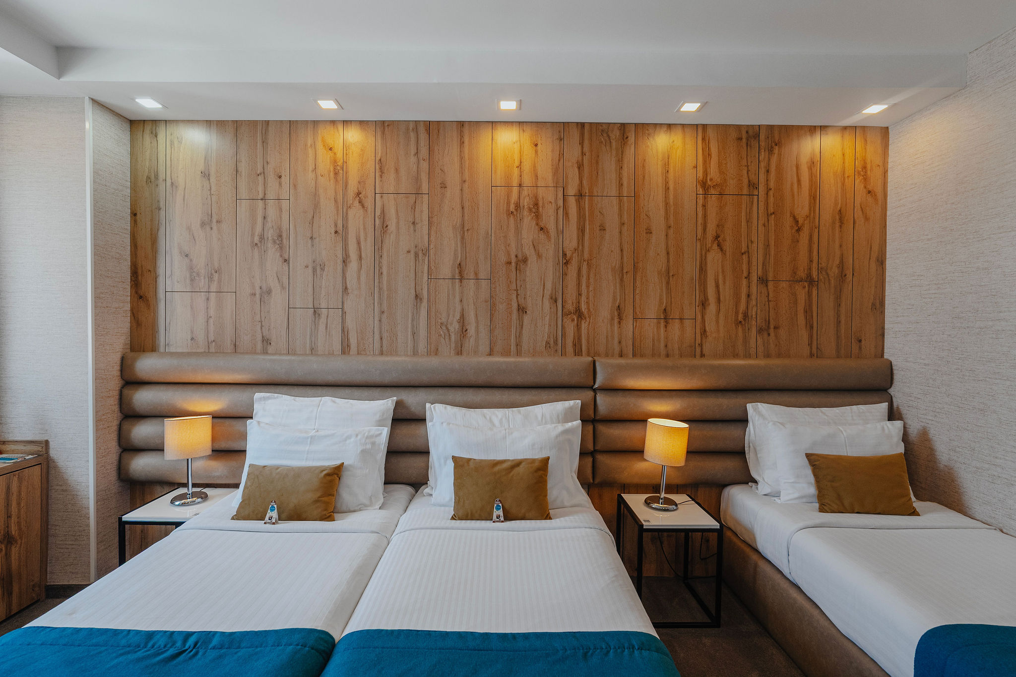 three beds in a triple hotel room