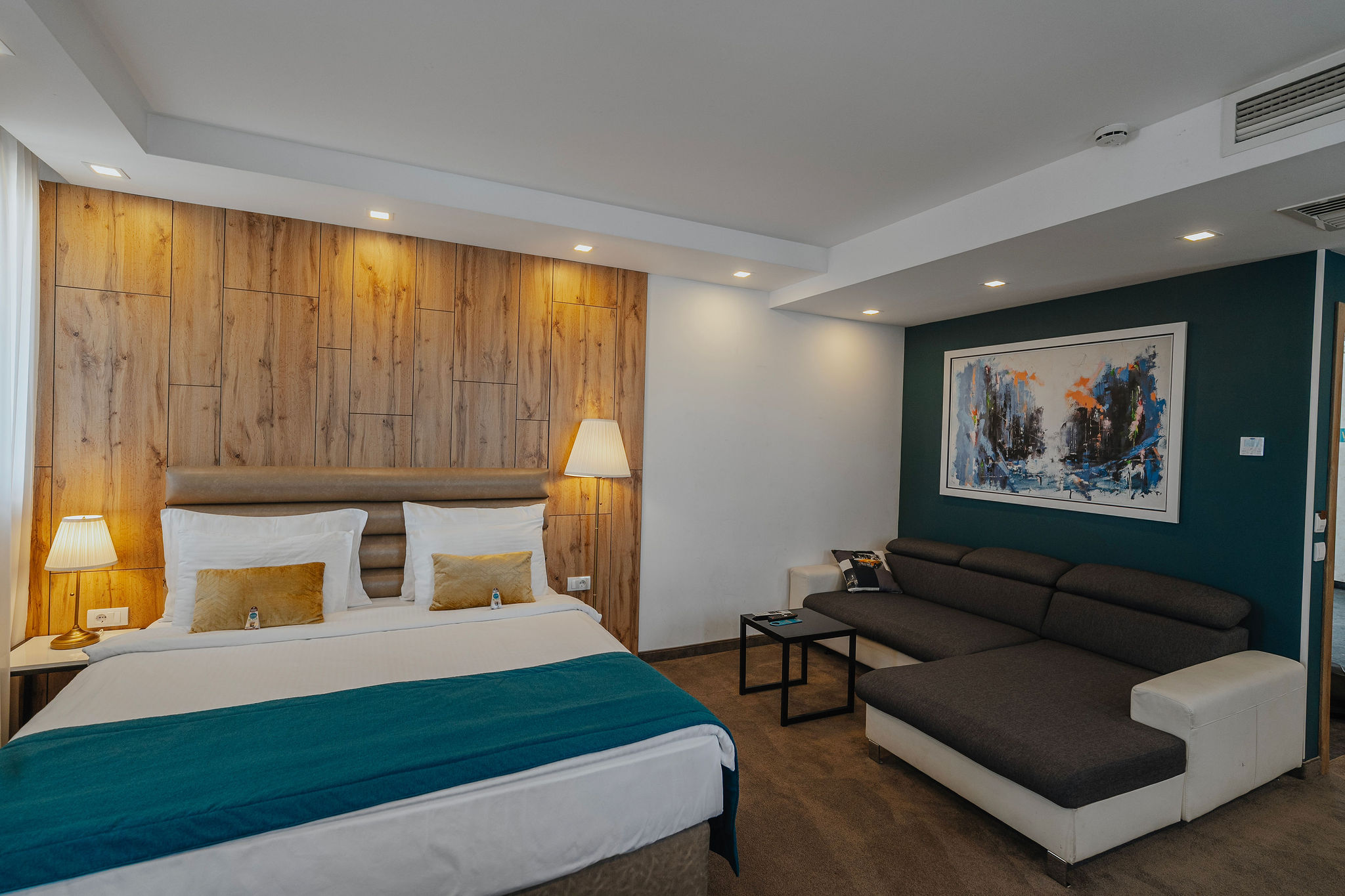 double hotel room and a corner sofa