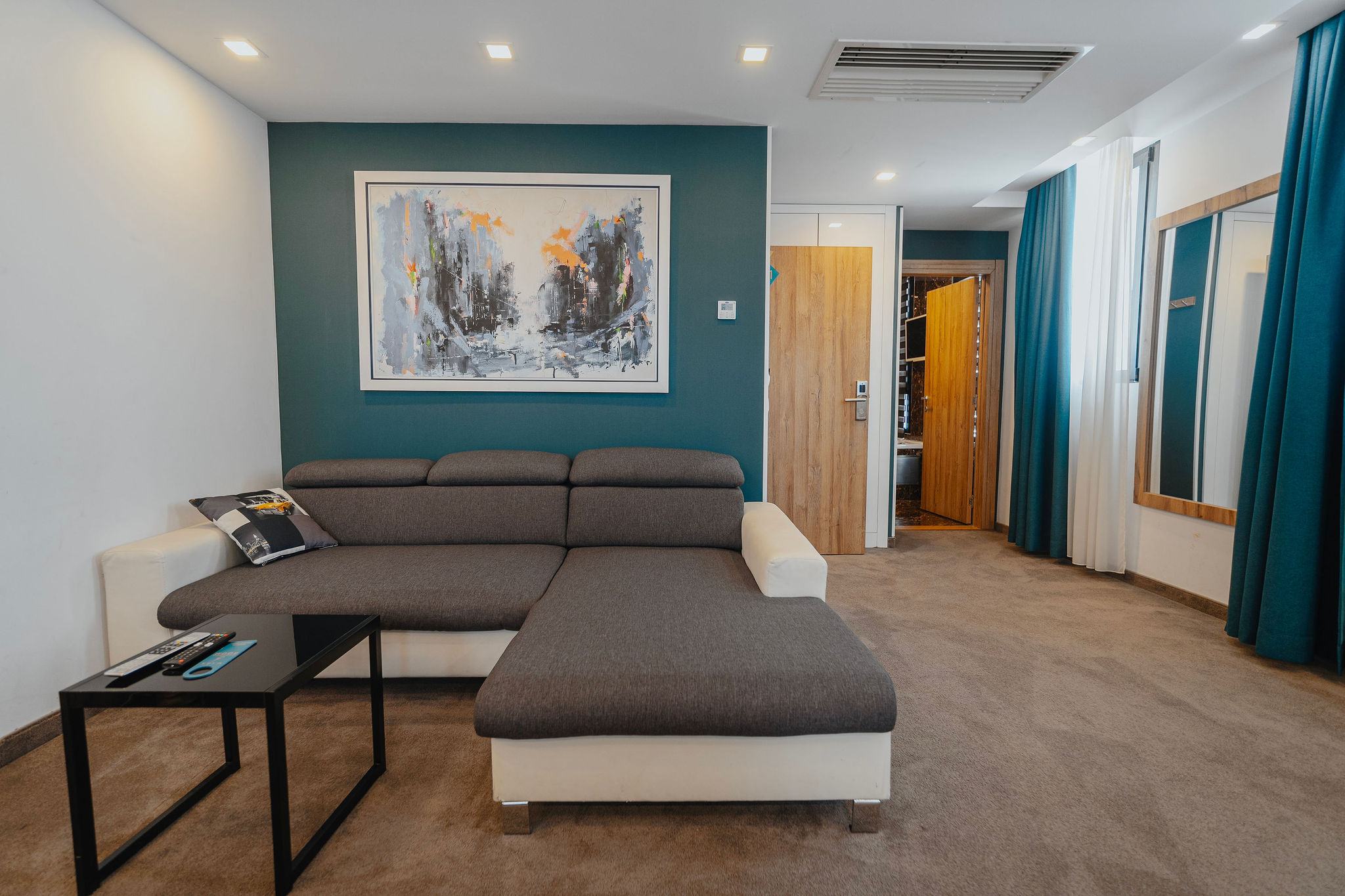 a large hotel room corner sofa